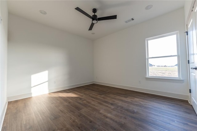 unfurnished room featuring ceiling fan and dark wood-type flooring