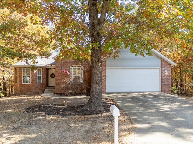 obstructed view of property with a garage