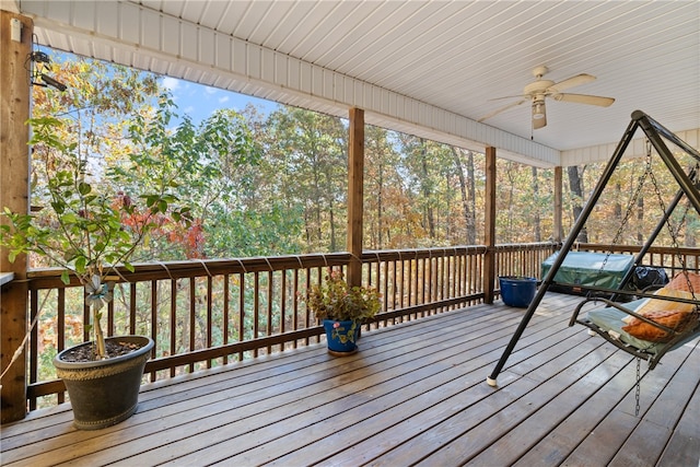 wooden deck featuring ceiling fan