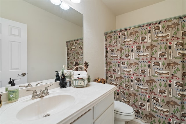 bathroom featuring vanity, a shower with curtain, and toilet