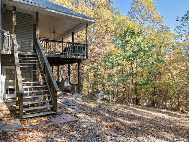 exterior space featuring a wooden deck and ceiling fan