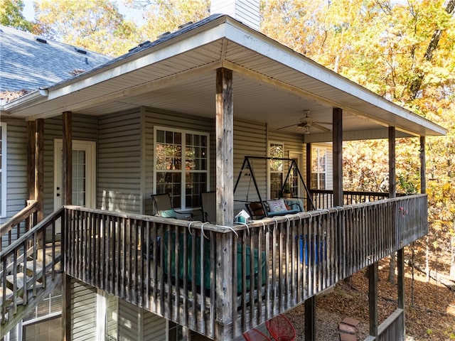 wooden terrace featuring ceiling fan