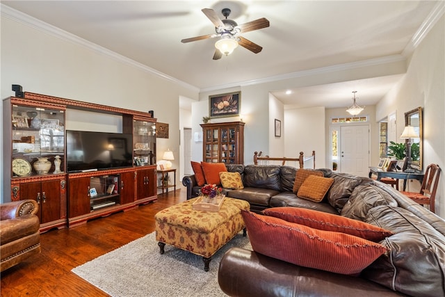 living room with crown molding, ceiling fan, and dark hardwood / wood-style flooring