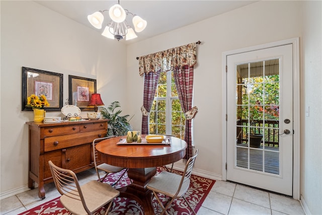 tiled dining area with a notable chandelier