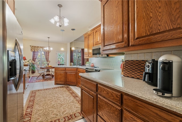 kitchen with pendant lighting, decorative backsplash, light tile patterned floors, stainless steel appliances, and an inviting chandelier