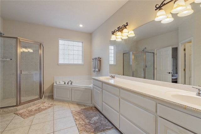 bathroom with tile patterned flooring, shower with separate bathtub, and vanity