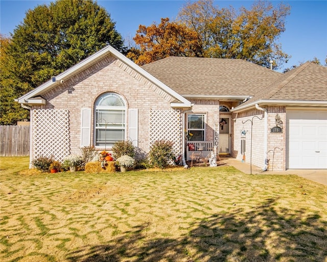 single story home with a front yard and a garage