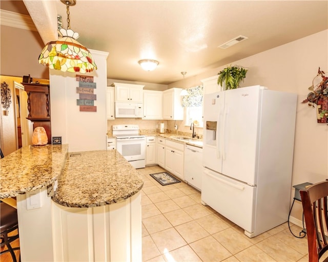 kitchen with hanging light fixtures, kitchen peninsula, a kitchen bar, white cabinetry, and white appliances