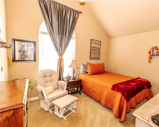 carpeted bedroom featuring lofted ceiling and multiple windows