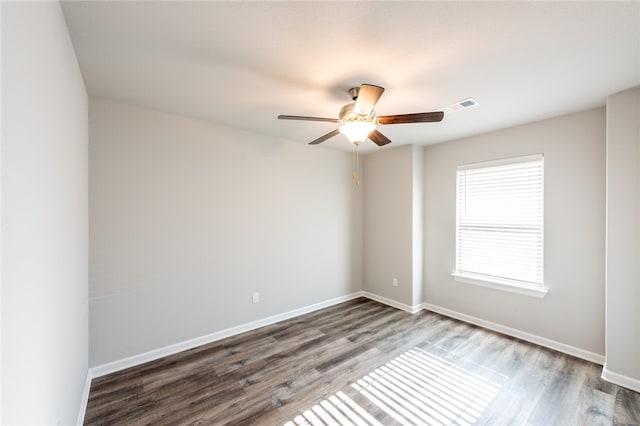 empty room with hardwood / wood-style flooring and ceiling fan