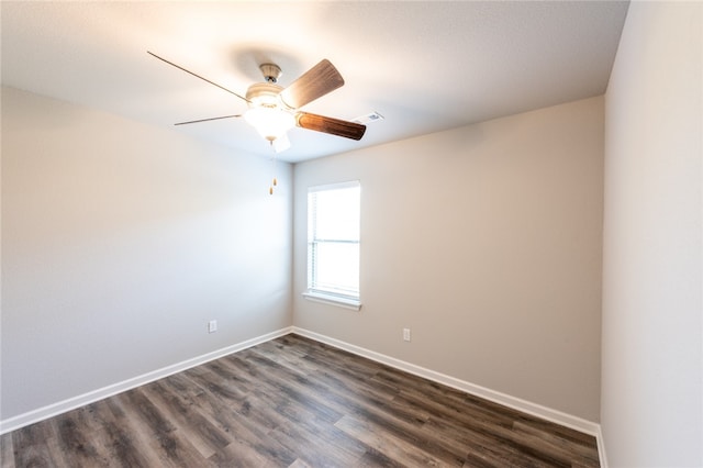 unfurnished room featuring ceiling fan and dark hardwood / wood-style flooring