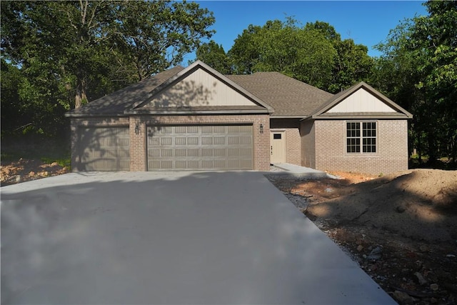 9306 Pleasant Valley Rd, Gentry, AR 72734 - ranch-style home with brick siding, a garage, and concrete driveway