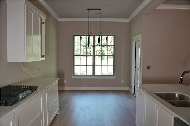 9306 Pleasant Valley Rd, Gentry, AR 72734 - unfurnished dining area with a sink, crown molding, light wood-style floors, a chandelier, and baseboards