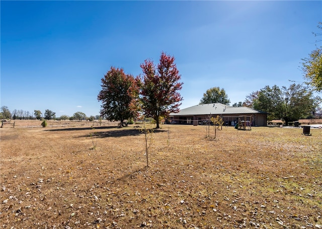 view of yard with a rural view