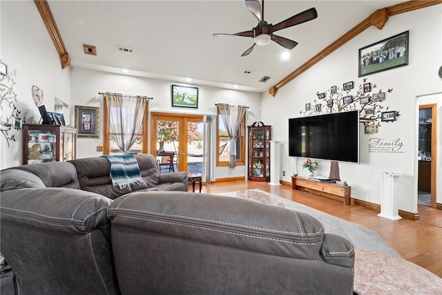 living room featuring lofted ceiling, french doors, light hardwood / wood-style flooring, crown molding, and ceiling fan