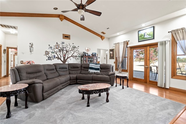 living room with french doors, light hardwood / wood-style floors, high vaulted ceiling, and ceiling fan