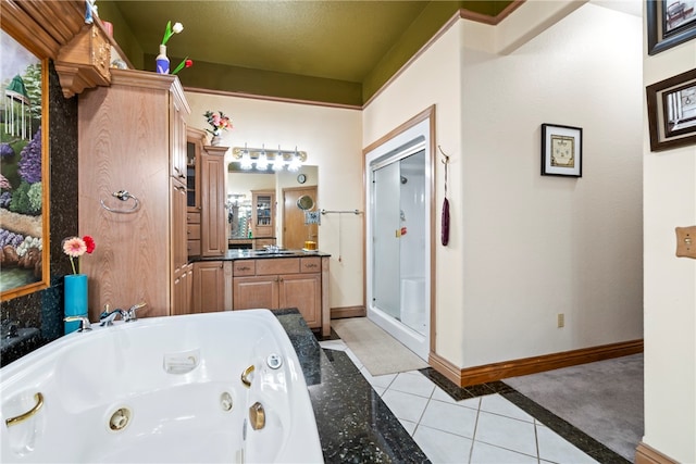 bathroom featuring vanity, tile patterned floors, independent shower and bath, and a textured ceiling