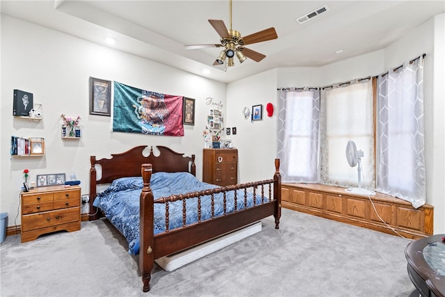 bedroom with ceiling fan and light carpet