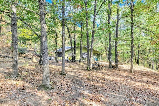 view of yard featuring a view of trees