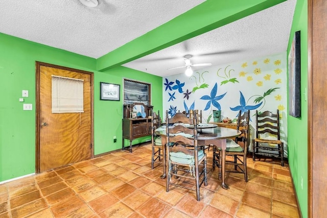 dining room with a ceiling fan and a textured ceiling