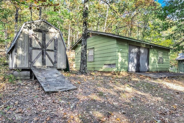 view of shed featuring a forest view