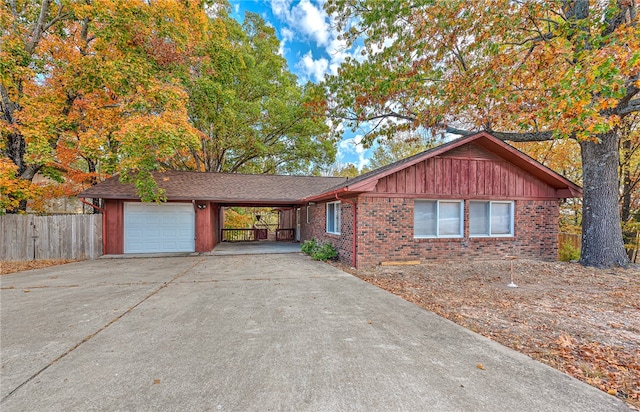 view of front of home featuring a garage and a carport