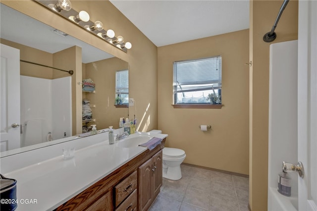 full bathroom with vanity, tub / shower combination, toilet, and tile patterned flooring