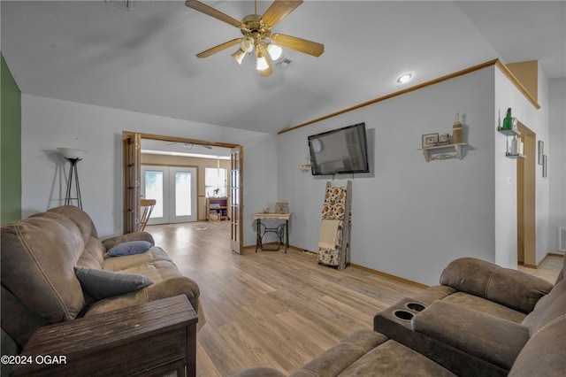 living room featuring french doors, light hardwood / wood-style floors, lofted ceiling, and ceiling fan