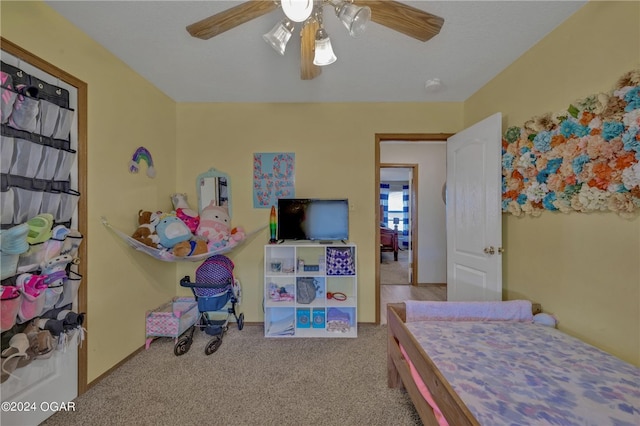 bedroom featuring light carpet and ceiling fan