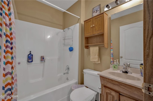 full bathroom with vanity, shower / bath combination with curtain, and toilet