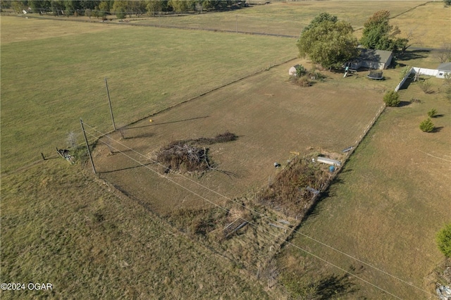 birds eye view of property with a rural view