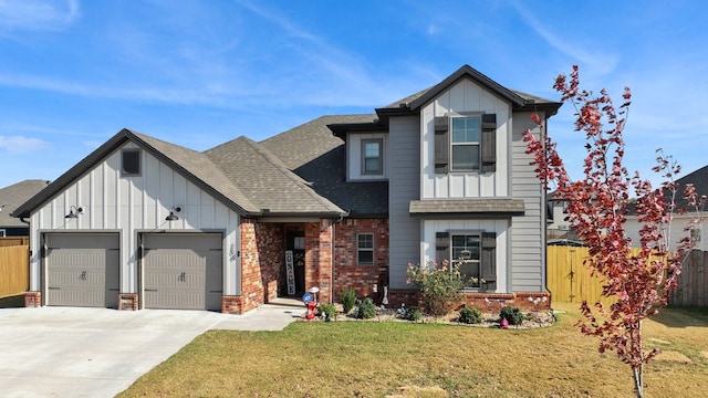 view of front facade with a front yard and a garage