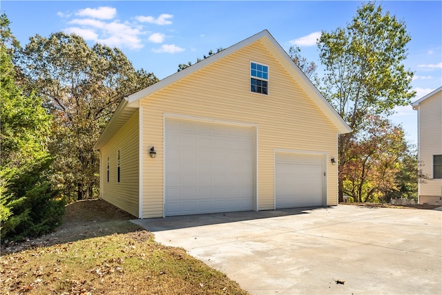 view of property exterior featuring an outbuilding and a garage