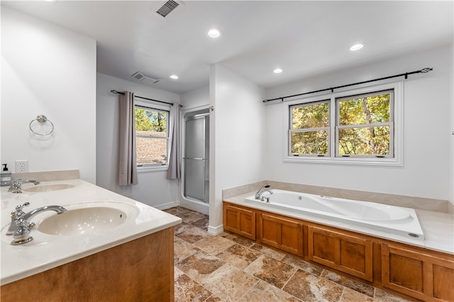 bathroom featuring vanity and plus walk in shower