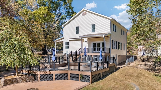 back of house with a wooden deck