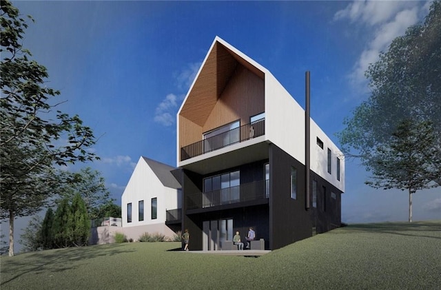 rear view of house featuring a lawn and a balcony