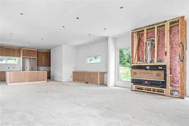 8912 Anew Rd, Rogers, AR 72756 - unfurnished living room featuring unfinished concrete floors
