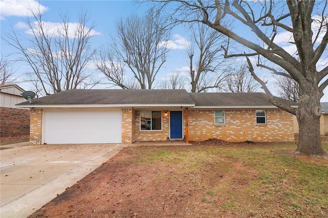 ranch-style home featuring a garage and a front lawn