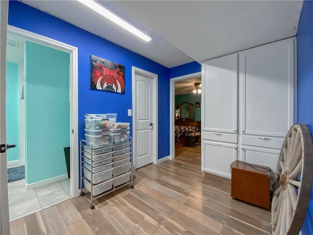 corridor featuring light hardwood / wood-style flooring