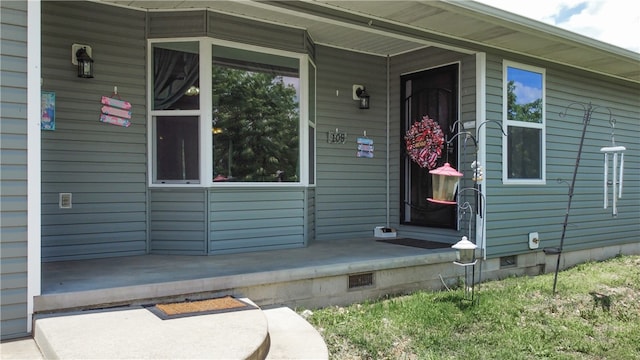 doorway to property with a porch