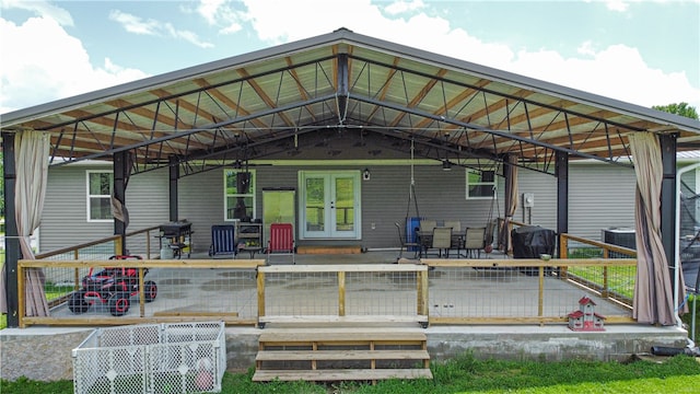 back of house featuring french doors, a patio area, and central AC unit