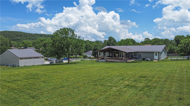 back of property featuring a yard