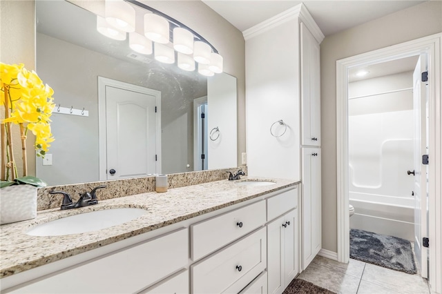 full bathroom featuring toilet, shower / bath combination, vanity, ornamental molding, and tile patterned flooring