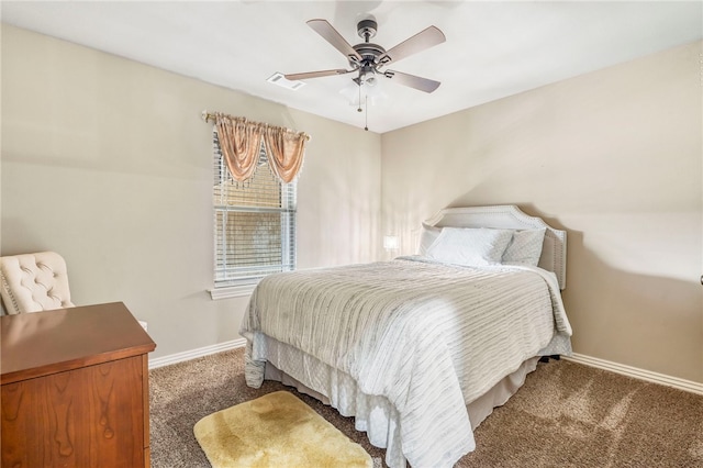 bedroom featuring dark carpet and ceiling fan