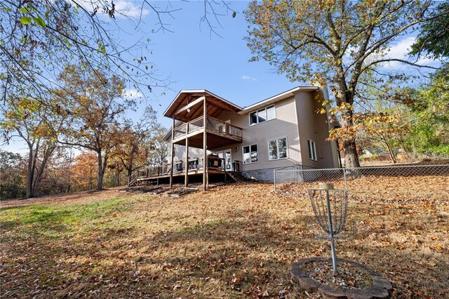 rear view of property featuring a deck