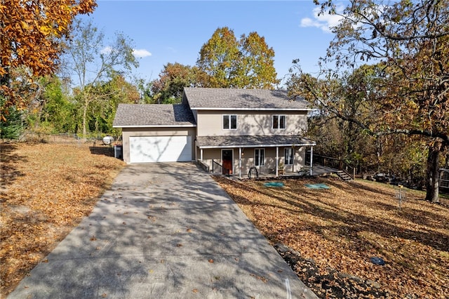 view of front facade featuring a garage and covered porch