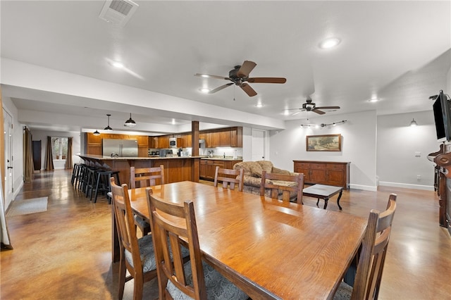 dining space with ceiling fan