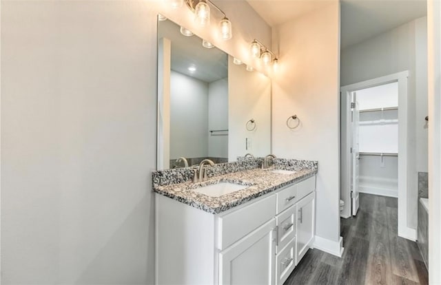 bathroom featuring vanity and wood-type flooring