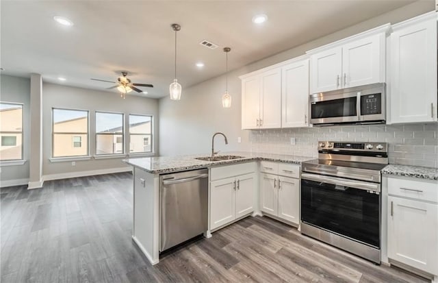 kitchen featuring appliances with stainless steel finishes and white cabinets