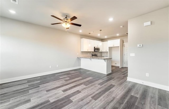 interior space with hardwood / wood-style flooring and ceiling fan